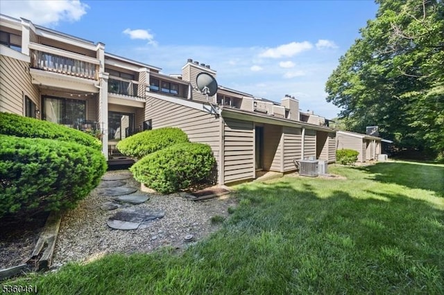39 Hillside Ct, Union Twp, NJ 08809 - rear view of property with a lawn and a chimney