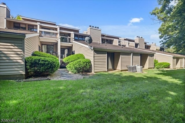 39 Hillside Ct, Union Twp, NJ 08809 - back of house featuring a lawn and a chimney