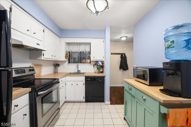 39 Hillside Ct, Union Twp, NJ 08809 - kitchen with appliances with stainless steel finishes, butcher block counters, white cabinets, light tile patterned flooring, and under cabinet range hood