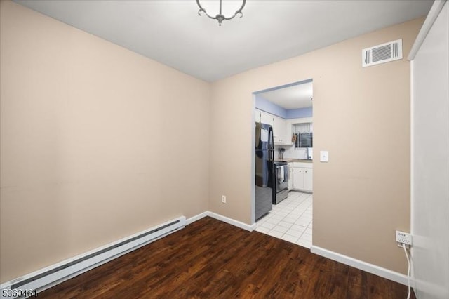 39 Hillside Ct, Union Twp, NJ 08809 - unfurnished room with baseboard heating and wood finished floors