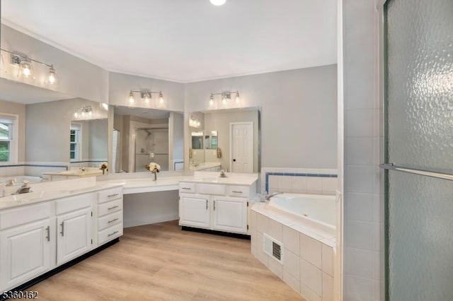 18 Hartley Ln, Bernards Twp, NJ 07920 - full bath with a shower stall, two vanities, a bath, and wood finished floors