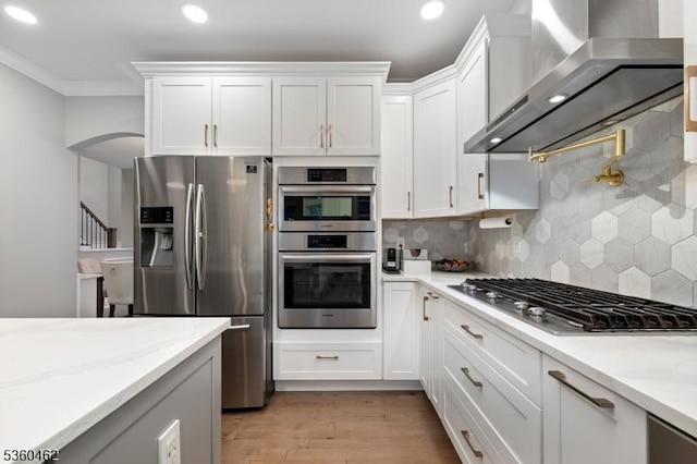 18 Hartley Ln, Bernards Twp, NJ 07920 - kitchen featuring wall chimney range hood, appliances with stainless steel finishes, recessed lighting, white cabinets, and backsplash