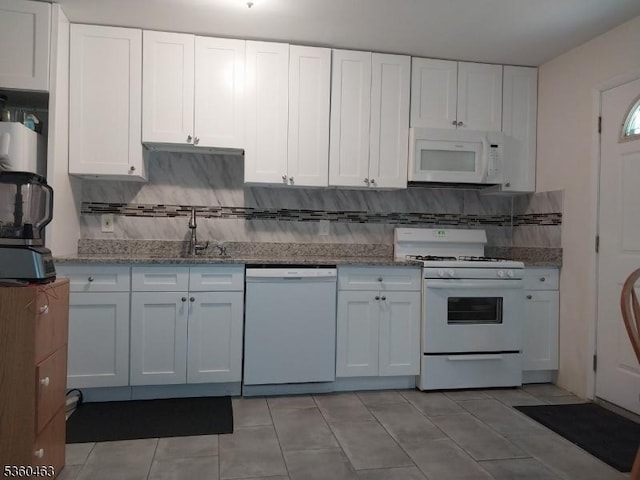 281 Reynolds Ter Unit 24, City Of Orange Twp, NJ 07050 - kitchen with white appliances, a sink, white cabinetry, and tasteful backsplash