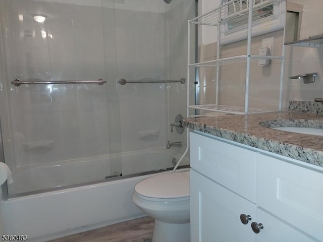 281 Reynolds Ter Unit 24, City Of Orange Twp, NJ 07050 - full bathroom with toilet, vanity, enclosed tub / shower combo, and wood finished floors