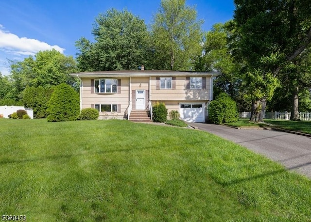 30 Fox Hill Rd, Fairfield Twp, NJ 07004 - split foyer home with driveway, a garage, and a front lawn