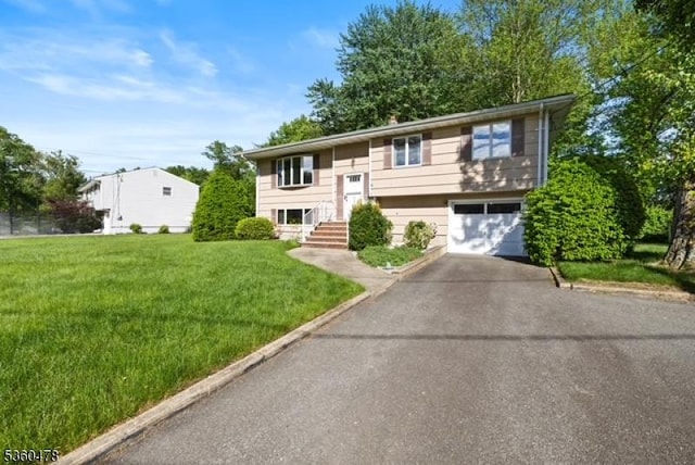 30 Fox Hill Rd, Fairfield Twp, NJ 07004 - raised ranch featuring driveway, an attached garage, and a front yard