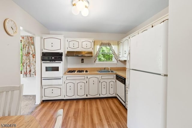 30 Fox Hill Rd, Fairfield Twp, NJ 07004 - kitchen with white appliances, a sink, light countertops, a warming drawer, and light wood-type flooring