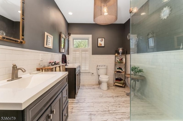 44 Main St, Califon Boro, NJ 07830 - bathroom with tile walls, vanity, a wainscoted wall, and wood finished floors