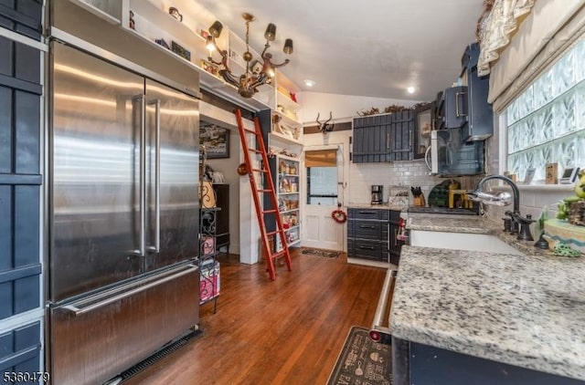 44 Main St, Califon Boro, NJ 07830 - kitchen with stainless steel built in refrigerator, dark wood-style floors, tasteful backsplash, lofted ceiling, and light stone countertops