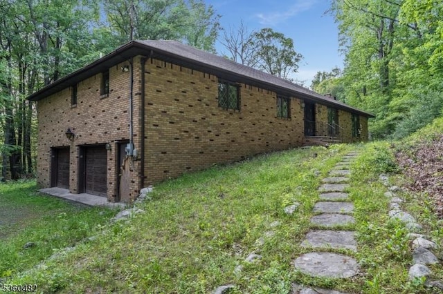 125 Free Union Rd, Liberty Twp, NJ 07823 - view of side of property featuring brick siding and a garage