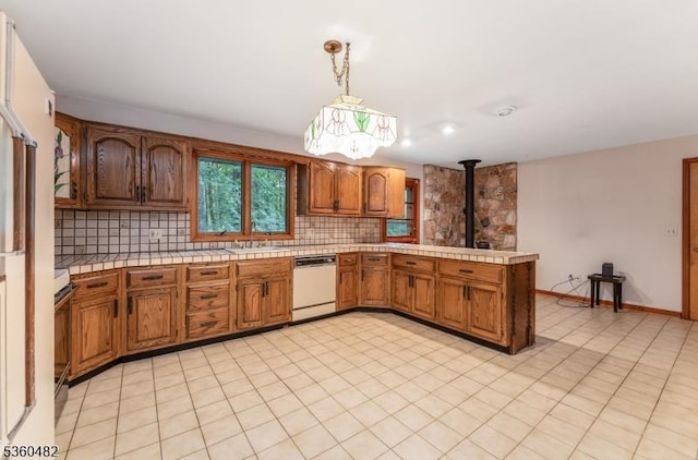 125 Free Union Rd, Liberty Twp, NJ 07823 - kitchen with dishwasher, tasteful backsplash, a peninsula, and brown cabinetry
