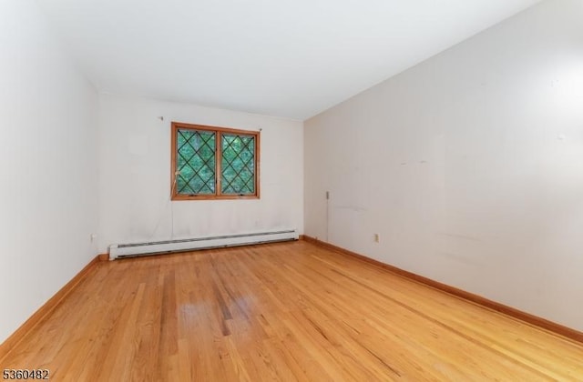 125 Free Union Rd, Liberty Twp, NJ 07823 - unfurnished room with a baseboard radiator and light wood finished floors