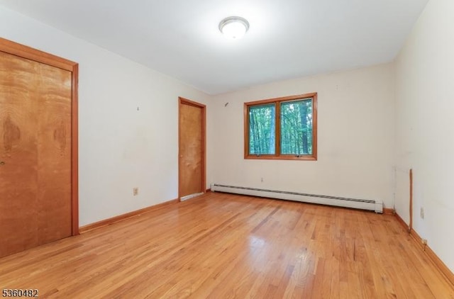 125 Free Union Rd, Liberty Twp, NJ 07823 - unfurnished room featuring baseboard heating and light wood finished floors