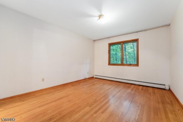 125 Free Union Rd, Liberty Twp, NJ 07823 - unfurnished room with a baseboard radiator and light wood-style floors
