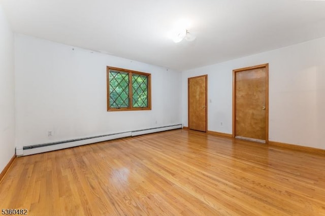 125 Free Union Rd, Liberty Twp, NJ 07823 - unfurnished room featuring baseboard heating and wood finished floors