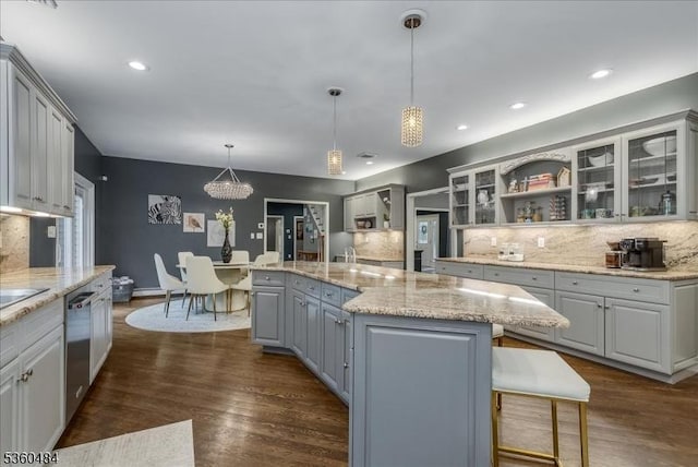 95 Underrock Rd, Sparta Twp, NJ 07871 - kitchen featuring stainless steel dishwasher, decorative backsplash, a center island, glass insert cabinets, and dark wood-style floors