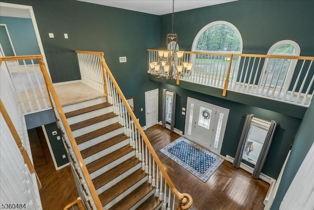 95 Underrock Rd, Sparta Twp, NJ 07871 - foyer featuring a chandelier, stairs, a towering ceiling, wood finished floors, and baseboards