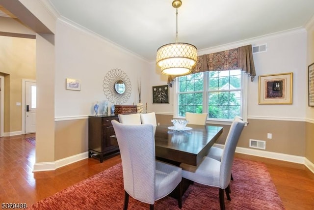 53 Patriots Way, Franklin Twp, NJ 08873 - dining room featuring wood finished floors, crown molding, and baseboards