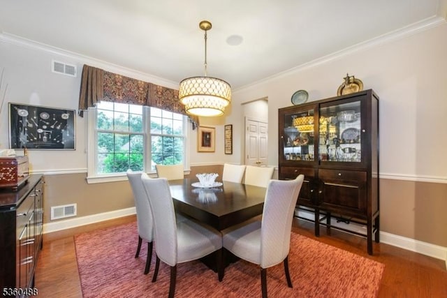 53 Patriots Way, Franklin Twp, NJ 08873 - dining area with wood finished floors, crown molding, and baseboards