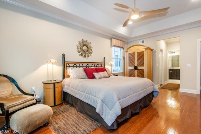 53 Patriots Way, Franklin Twp, NJ 08873 - bedroom featuring hardwood / wood-style floors, a raised ceiling, baseboards, ensuite bathroom, and ornamental molding