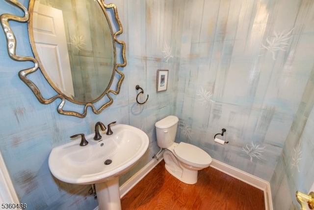 53 Patriots Way, Franklin Twp, NJ 08873 - half bathroom with wood finished floors, toilet, and baseboards