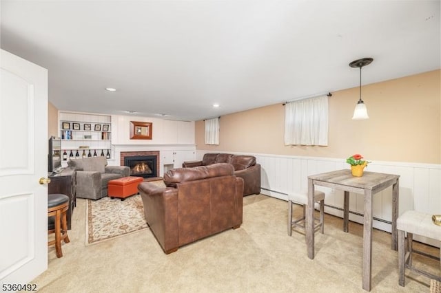 107 Shady Ln, Randolph Twp, NJ 07869 - living area featuring a baseboard heating unit, wainscoting, a fireplace, and carpet floors