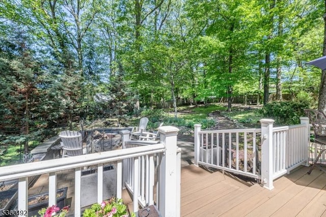 107 Shady Ln, Randolph Twp, NJ 07869 - wooden terrace with a fire pit and view of wooded area