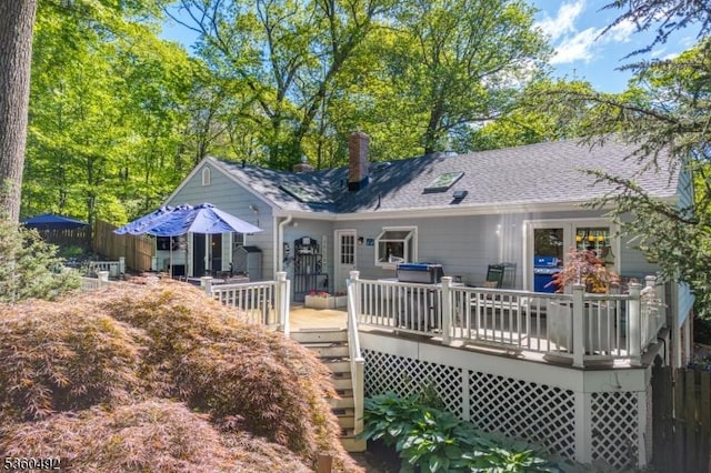 107 Shady Ln, Randolph Twp, NJ 07869 - back of house with a wooden deck, roof with shingles, and a chimney