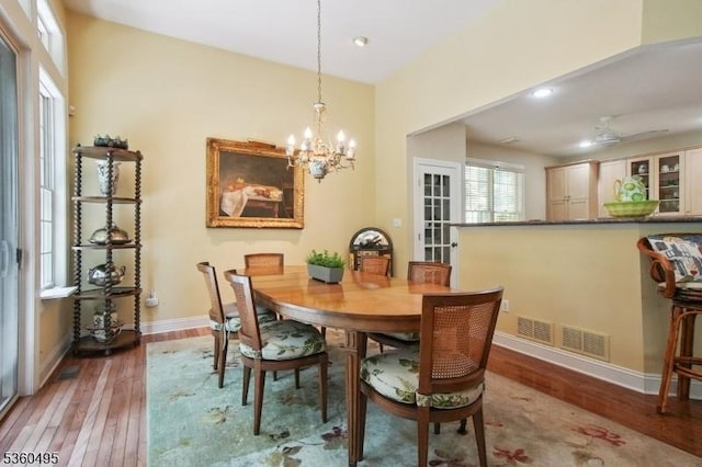 81 Schindler Way, Fairfield Twp, NJ 07004 - dining area featuring baseboards, wood-type flooring, a chandelier, and recessed lighting