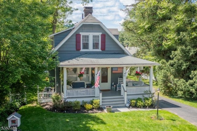 82 Washington Ave, Chatham Boro, NJ 07928 - view of front of property featuring covered porch, a front lawn, a chimney, and roof with shingles