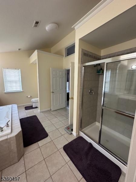 30 Julie Ct, Franklin Twp, NJ 08873 - bathroom featuring tile patterned flooring, a stall shower, a bath, toilet, and baseboards