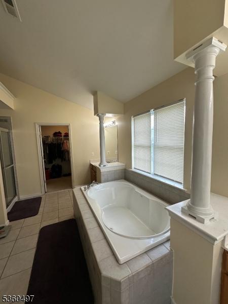 30 Julie Ct, Franklin Twp, NJ 08873 - bathroom featuring decorative columns, tile patterned floors, a bath, vanity, and lofted ceiling