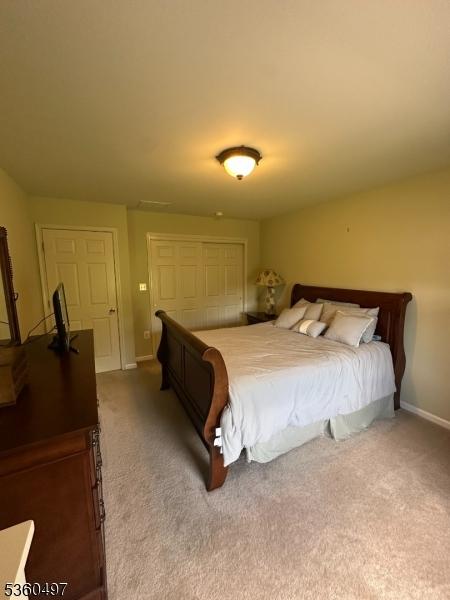 30 Julie Ct, Franklin Twp, NJ 08873 - carpeted bedroom with a closet and baseboards