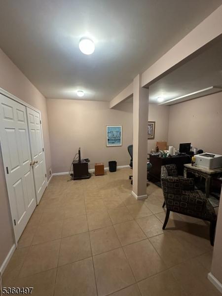 30 Julie Ct, Franklin Twp, NJ 08873 - finished below grade area featuring an office area, light tile patterned flooring, and baseboards