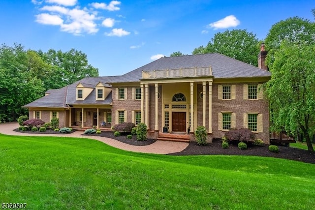 10 Beacon Hill Dr, Chester Twp, NJ 07930 - greek revival house with a front yard, brick siding, a chimney, and a porch
