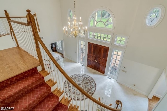 10 Beacon Hill Dr, Chester Twp, NJ 07930 - foyer featuring a towering ceiling, a chandelier, baseboards, and stairway