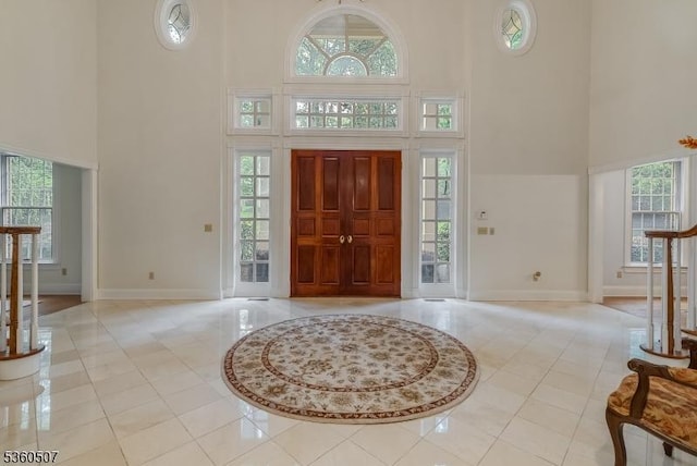 10 Beacon Hill Dr, Chester Twp, NJ 07930 - foyer with a high ceiling, light tile patterned flooring, baseboards, and healthy amount of natural light