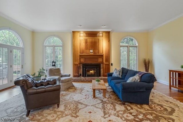 10 Beacon Hill Dr, Chester Twp, NJ 07930 - living room featuring plenty of natural light, wood finished floors, ornamental molding, a brick fireplace, and baseboards