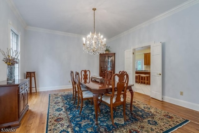10 Beacon Hill Dr, Chester Twp, NJ 07930 - dining space featuring a chandelier, crown molding, light wood-style floors, and baseboards