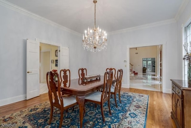 10 Beacon Hill Dr, Chester Twp, NJ 07930 - dining room featuring a chandelier, light wood-style flooring, stairway, plenty of natural light, and ornamental molding
