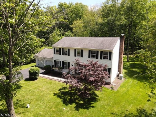 15 Fox Run, Parsippany-Troy Hills Twp, NJ 07834 - colonial house with a chimney, an attached garage, asphalt driveway, and a front yard
