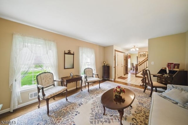 15 Fox Run, Parsippany-Troy Hills Twp, NJ 07834 - living room with wood finished floors, stairs, a chandelier, and baseboards