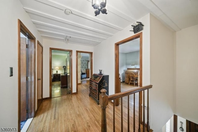 15 Fox Run, Parsippany-Troy Hills Twp, NJ 07834 - hallway with light wood-style flooring, beam ceiling, and an upstairs landing