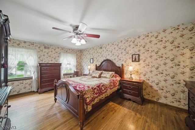 15 Fox Run, Parsippany-Troy Hills Twp, NJ 07834 - bedroom with wallpapered walls, wood finished floors, baseboards, and a ceiling fan