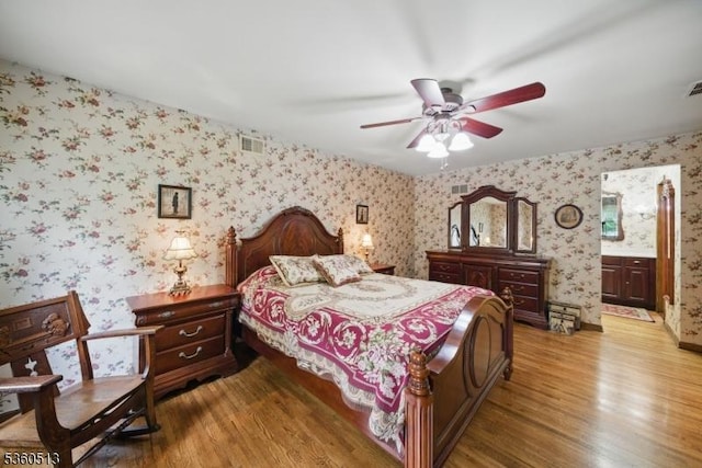 15 Fox Run, Parsippany-Troy Hills Twp, NJ 07834 - bedroom with wallpapered walls, wood finished floors, ensuite bath, and a ceiling fan