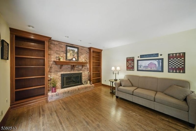 15 Fox Run, Parsippany-Troy Hills Twp, NJ 07834 - living area with built in shelves, baseboards, wood finished floors, and a fireplace
