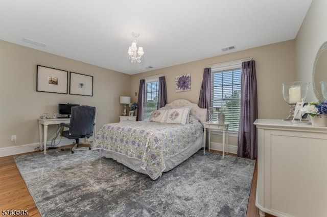 19 Britton Rd, Delaware Twp, NJ 08559 - bedroom with multiple windows, wood finished floors, a chandelier, and baseboards
