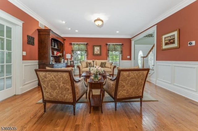 19 Britton Rd, Delaware Twp, NJ 08559 - living area with light wood finished floors, a wainscoted wall, a decorative wall, ornamental molding, and stairway