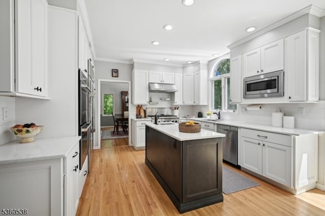 1 Colby Farm Rd, Chester Twp, NJ 07930 - kitchen featuring stainless steel appliances, under cabinet range hood, an island with sink, recessed lighting, and white cabinetry