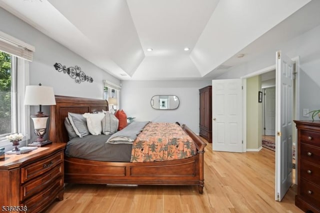 1 Colby Farm Rd, Chester Twp, NJ 07930 - bedroom with multiple windows, light wood finished floors, vaulted ceiling, recessed lighting, and a tray ceiling